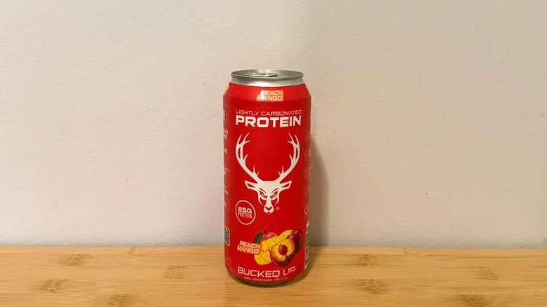 A can of Bucked Up Peach Mango Protein Soda