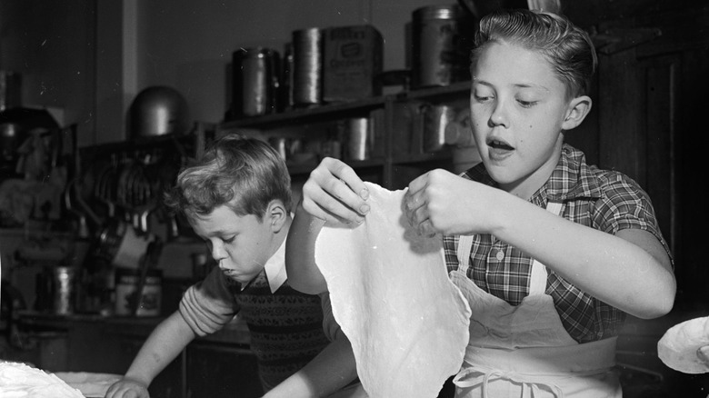 Christopher Walken shaping pie crust in Walken's Bakery as a boy