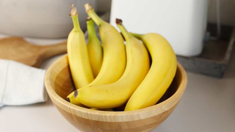 bananas in wooden bowl