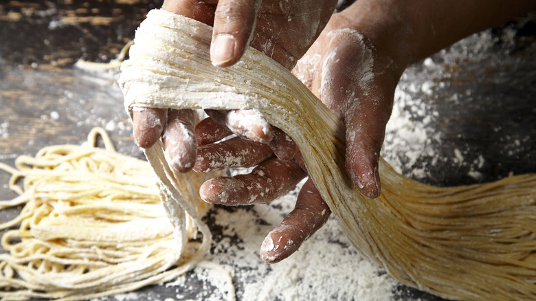 person making pasta