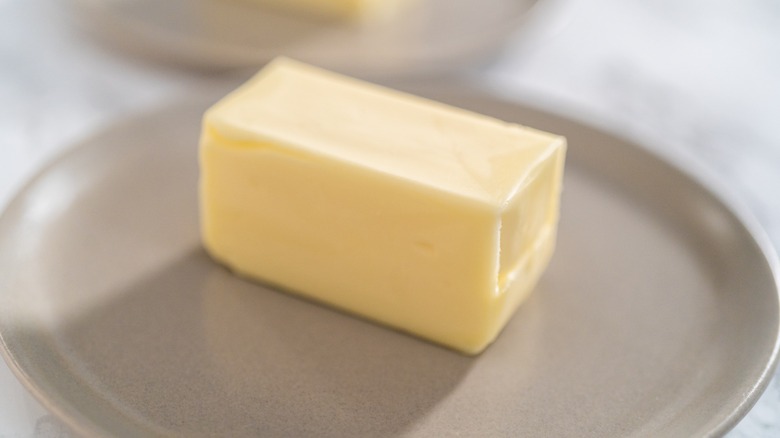 Stick of butter on a plate
