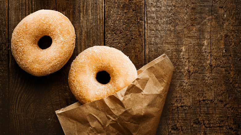 two donuts with paper bag