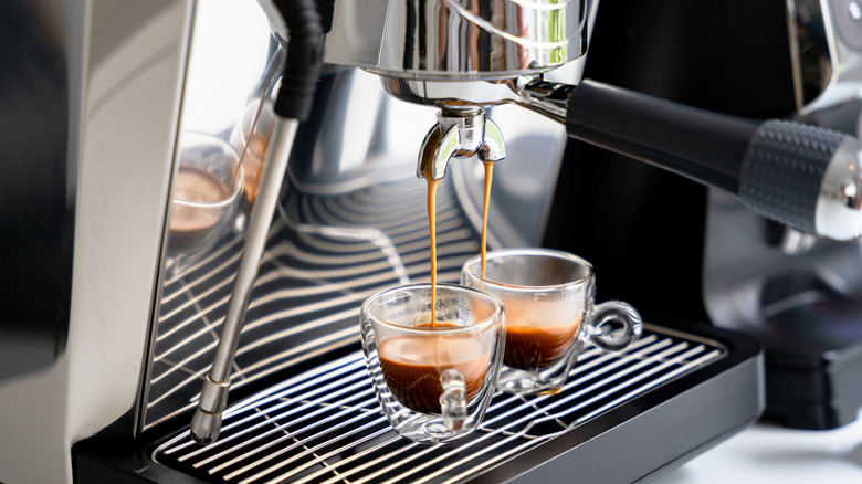 an espresso machine pulling two shots of espresso