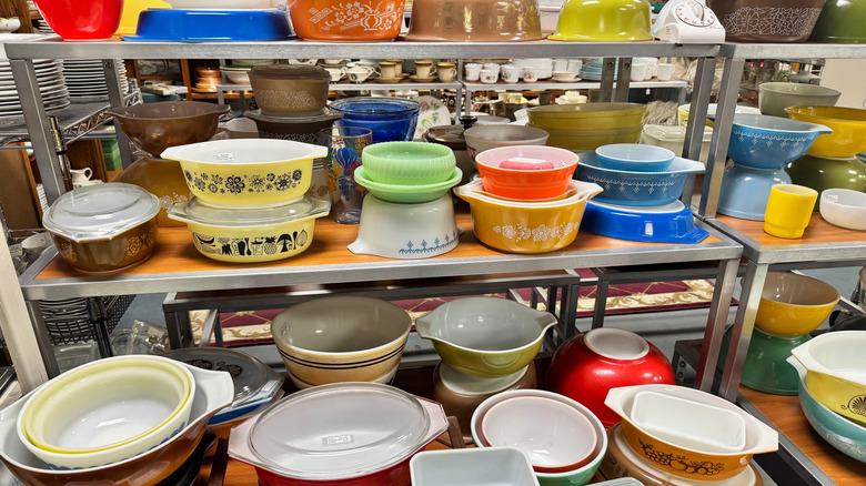 Vintage Pyrex shown on thrift store shelves