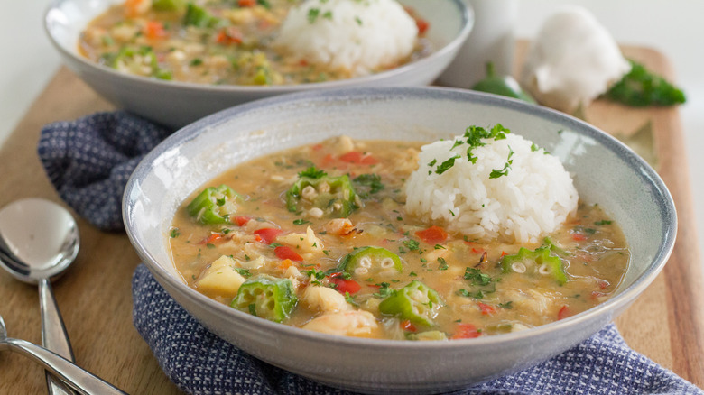 Two bowls of shrimp and okra gumbo with rice