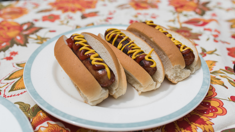 three hot dogs with new england rolls