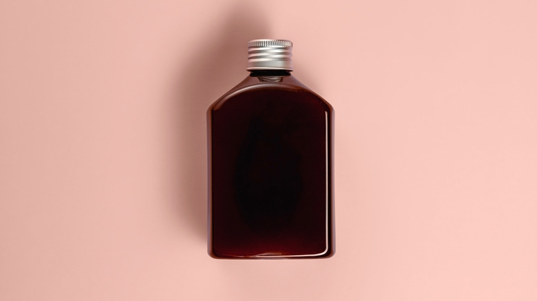 Bottled cold brew on a pink background