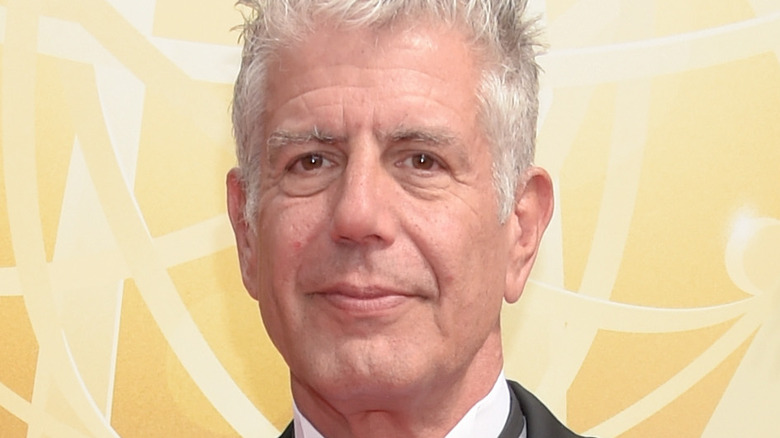 Anthony Bourdain smiling at an event 