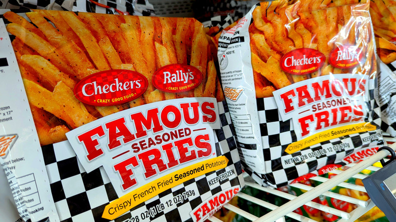 bags of frozen Checkers fries in a grocery store freezer