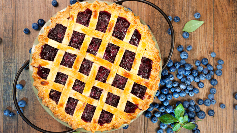 Blueberry pie above fresh blueberries