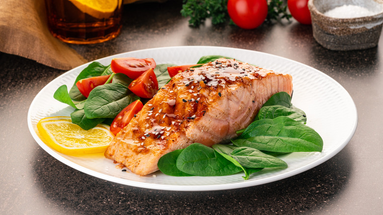 salmon on plate with spinach