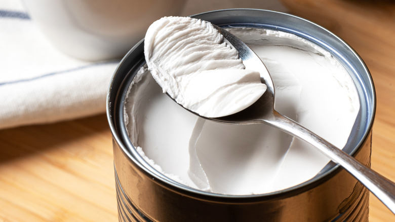 Thick canned coconut milk layer scraped with spoon