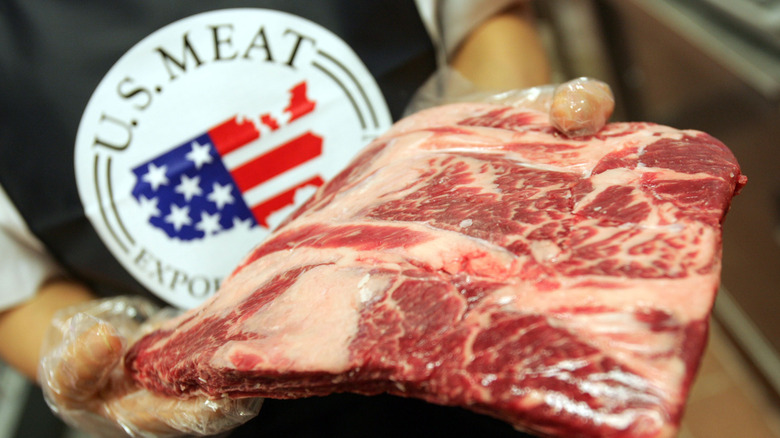 Person holding beef package US