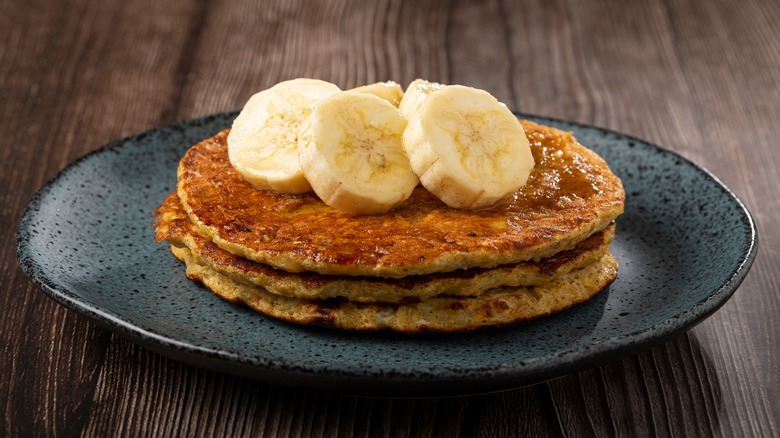 oatmeal pancakes topped with bananas