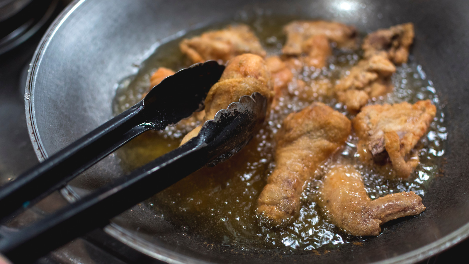 The Reason You Should Consider Using A Wok For Deep Frying