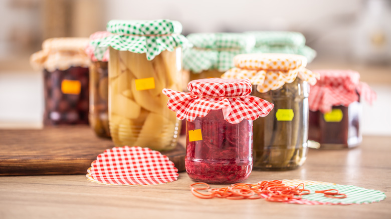 Home canned goods in glass jars with gingham tops