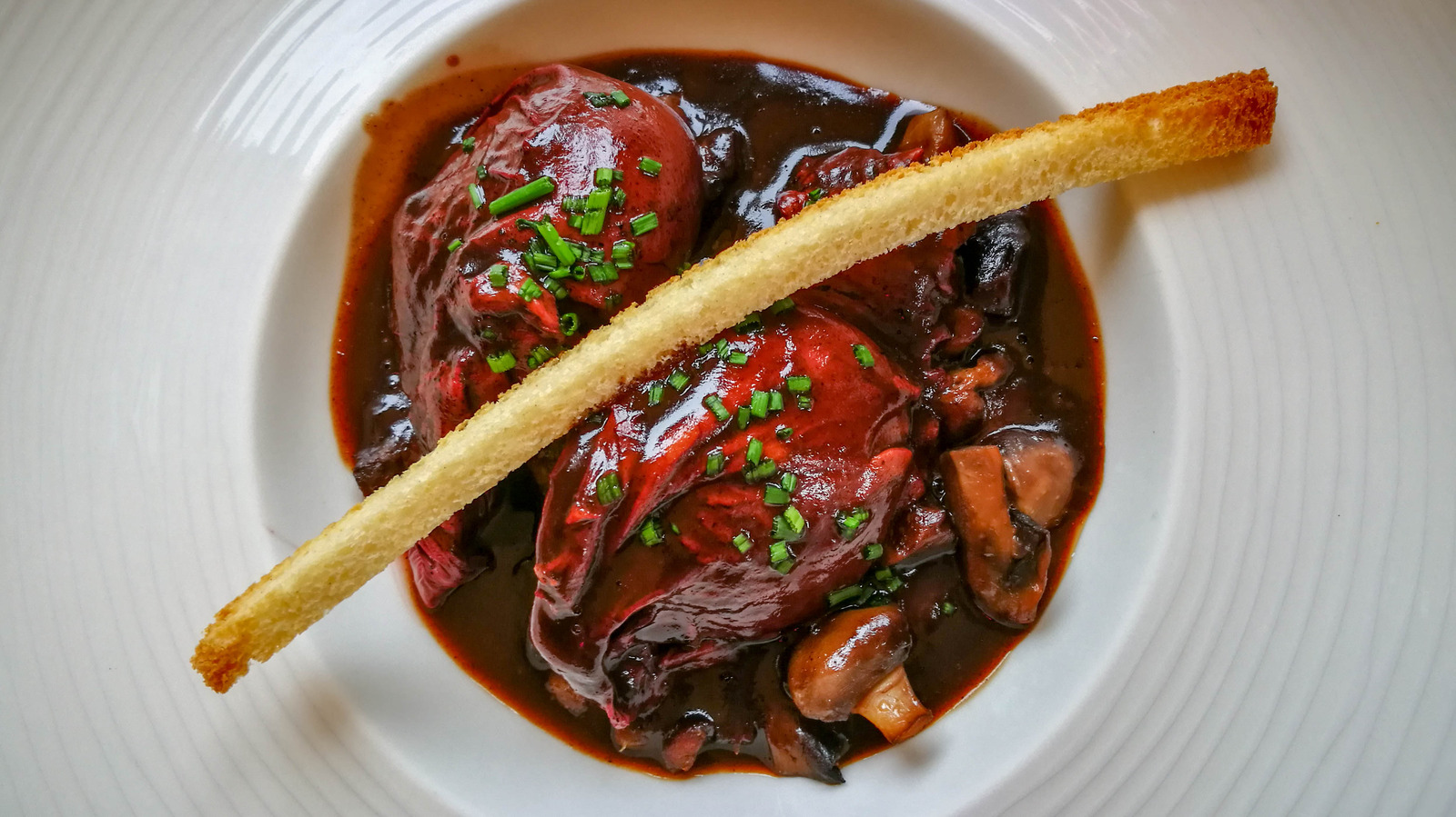 The Reason You Should Poach Eggs In Wine