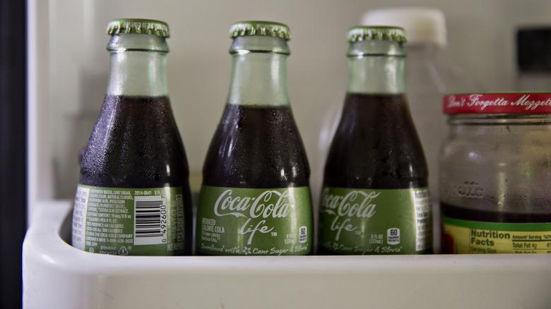 Coca-Cola bottles in fridge door