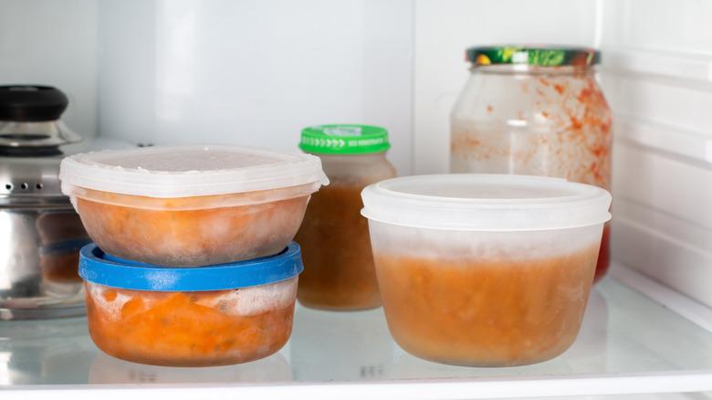 glass containers of food in freezer