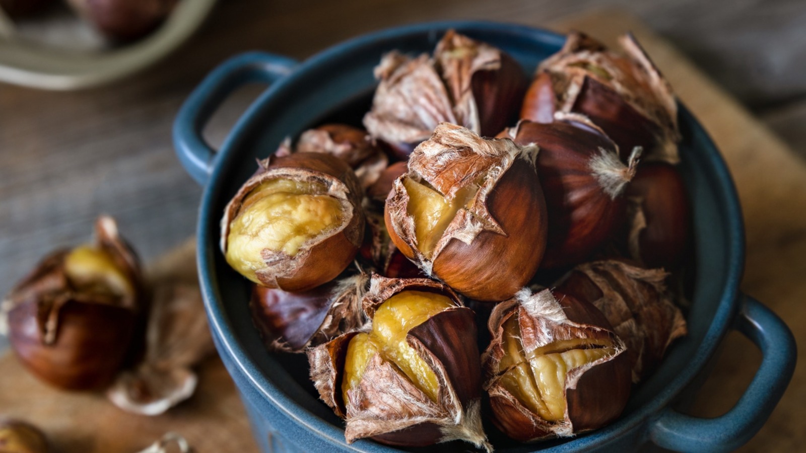 https://www.tastingtable.com/img/gallery/the-reason-youll-want-to-score-chestnuts-before-roasting/l-intro-1693922974.jpg