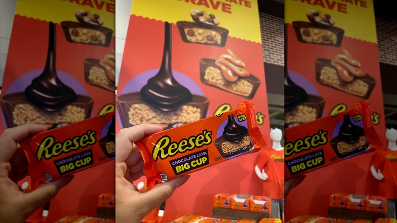 Hand holding Reese's Chocolate Lava Big Cup
