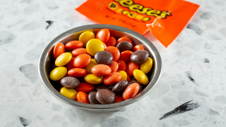 Reese's Pieces in bowl on table