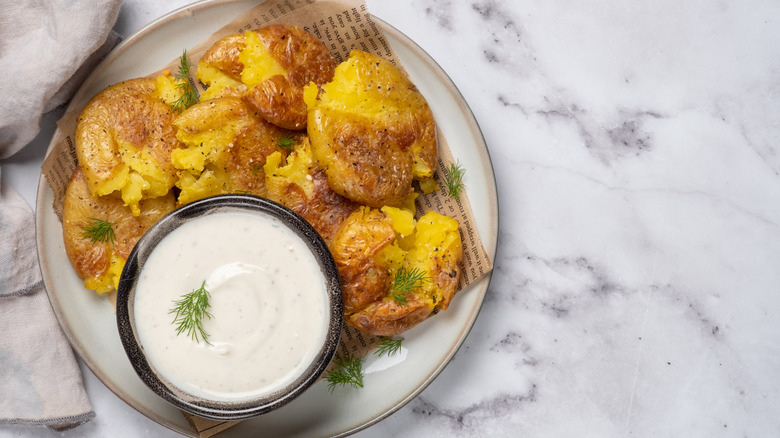 bowl of smashed potatoes and dip