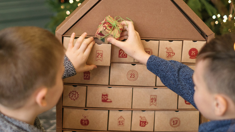 Kids taking selection from Advent calendar