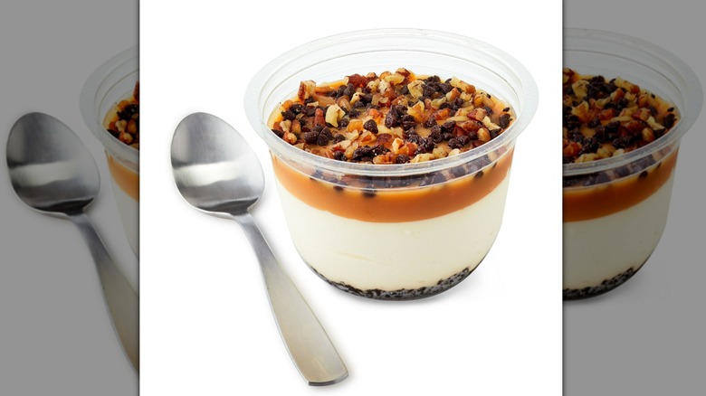 An open Marketside Turtle French Style Creamy Cheesecake Mousse  next to a spoon
