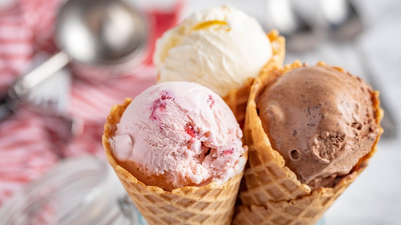 strawberry, vanilla, and chocolate ice cream cones