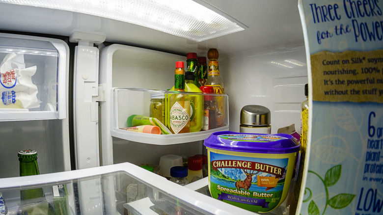 Hot sauce in front of refrigerator