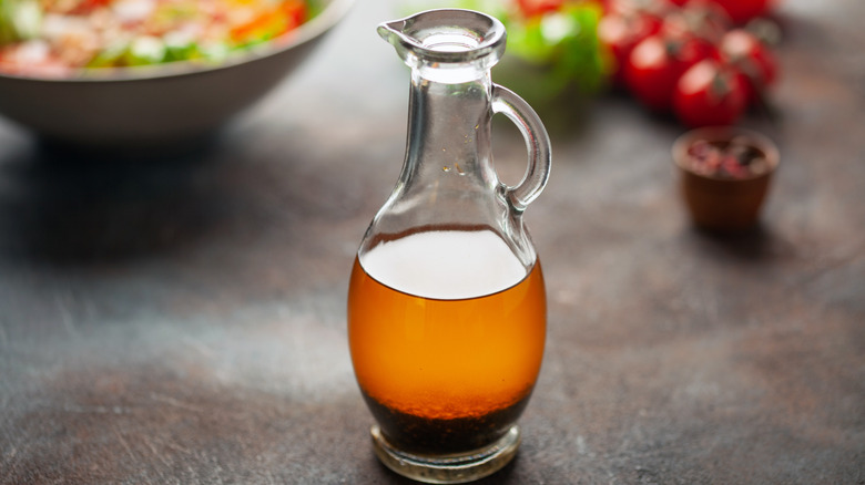 glass container of vinaigrette
