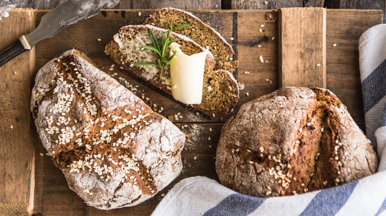 loaves of irish brown bread on a wooden table