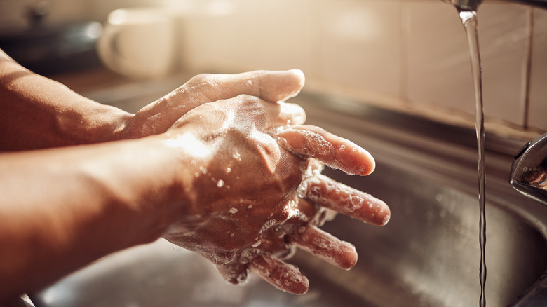 A person washing their hands