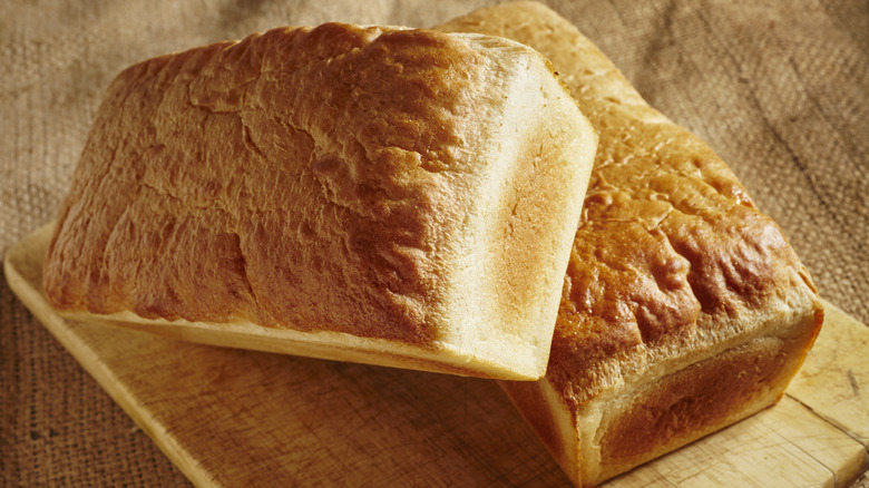 bread loaves on cutting board
