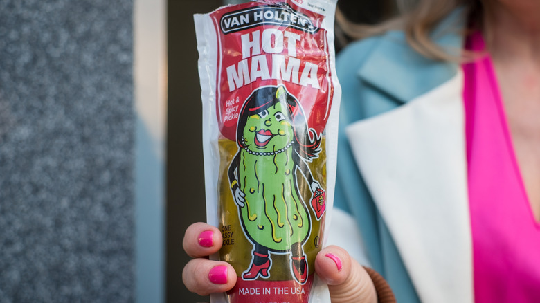 woman holding a Van Holten's Pickle-in-a-Pouch