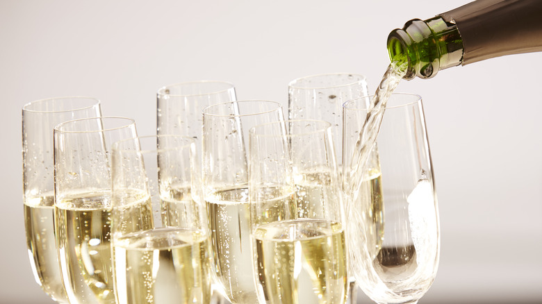 pouring bubbles at party