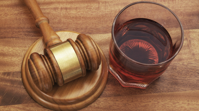 Judge's gavel and whisky glass