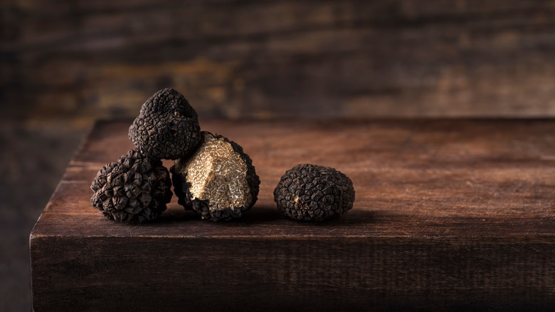 black truffles on a wooden table