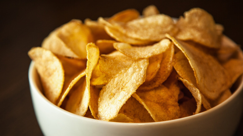 crunchy potato chips in bowl