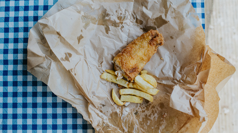 Fried fish and french fries in a basket
