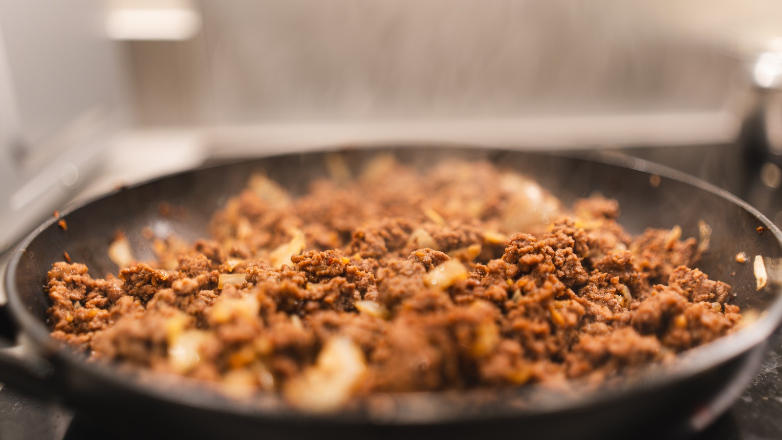 The Seasoning Mistake That's All Too Common When Cooking Ground Beef - Tasting Table
