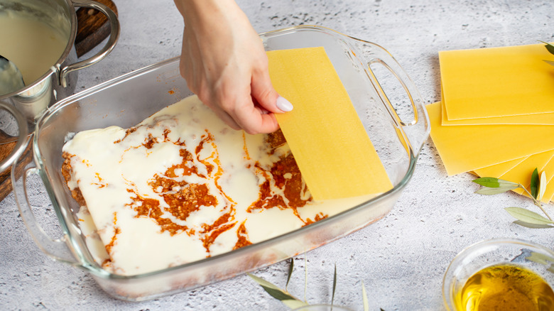 Person making lasagna