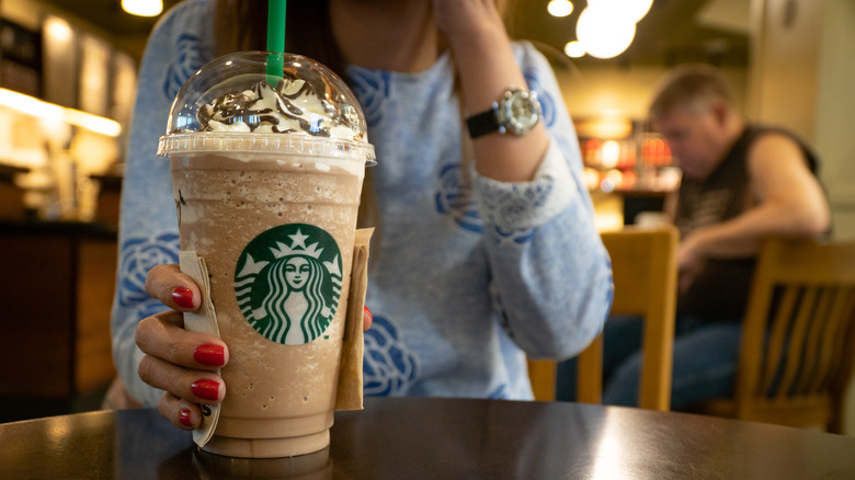 woman drinking Frappuccino