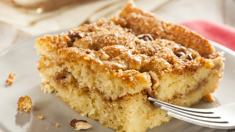 Piece of coffee cake on a plate with fork