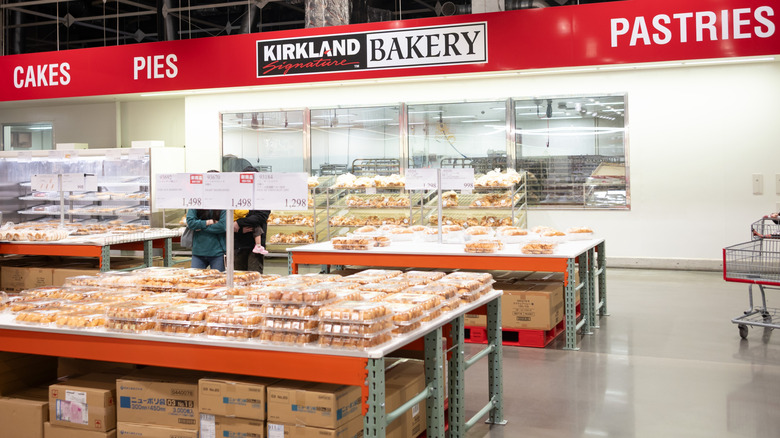 A Costco bakery, with packages of pastries in the foreground