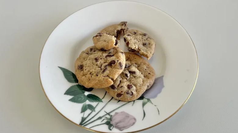 A white plate with three Costco mini chocolate chip cookies
