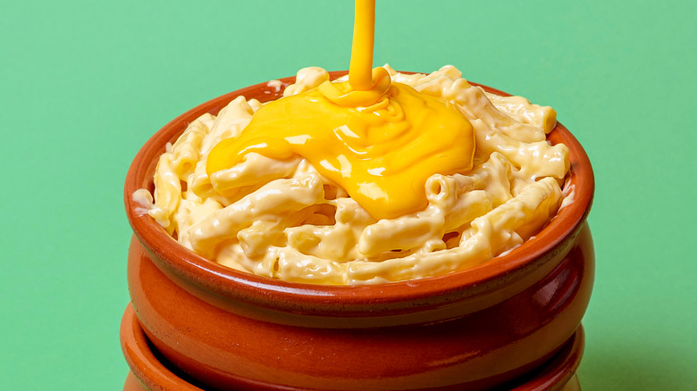 cheese sauce poured over macaroni