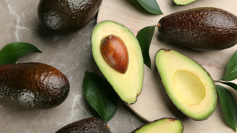 whole and cut avocados