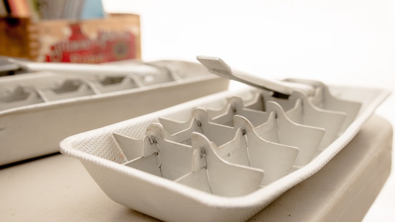A vintage lever operated ice cube tray